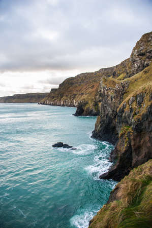 Scenic view over coastline and sea in the Northern Ireland in winter. Concepts: landscape, outdoor, tourism, travelの写真素材