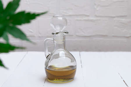 CBD cannabis oil in a jar on white tableの写真素材