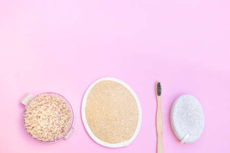 Eco-friendly bathroom accessories on soft pink pastel background. Image with copy space, top viewの写真素材