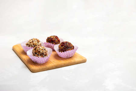 Natural raw vegan snacks energy balls on neutral concrete backgrounの写真素材