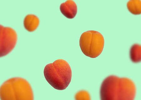 Bright summer apricotes of different sizes flying