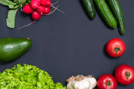 Raw fresh vegetables on black background with copy space. Alkaline diet conceptの写真素材