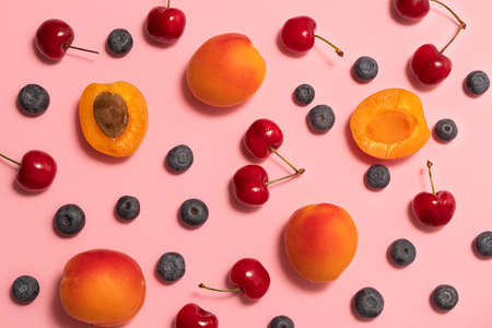 Top view of fresh summer fruits and berries background