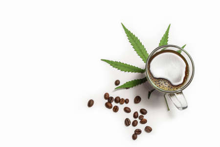 Above view of cannabis-infused coffee in a glass cup on white backgroundの写真素材