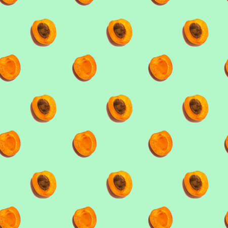 Fresh apricot fruit seamless pattern on mint backgroundの写真素材