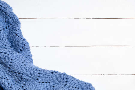 Knitted woolen blanket on white wooden backgroundの写真素材