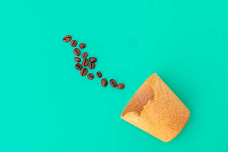 Eco friendly waffle cup for take away coffee that you can eat afterwards and roasted coffee beans on...