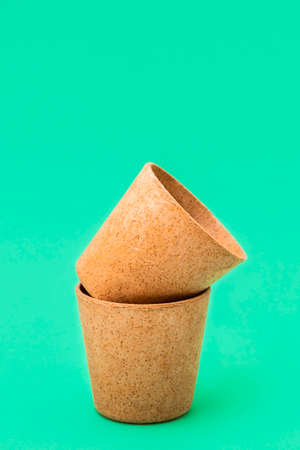 Eco-friendly type of cup - cone cups made from waffle on green background, vertical imageの写真素材