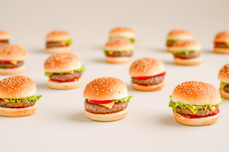 Mini burgers as Superbowl Sunday food on light backgroundの素材