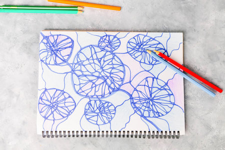 Neurographic drawing on gray background with colorful pencils