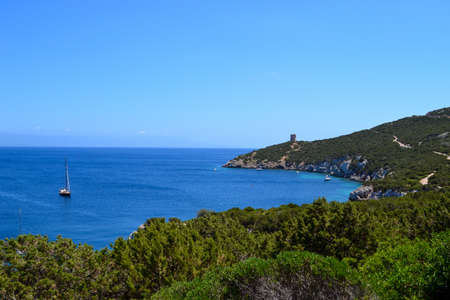 Aereal view of seaside landscape on a beautiful summer day - blue water, cliffs and old tower in the...