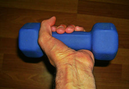 Dumbell in handの写真素材