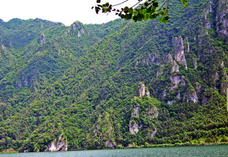 Cliffs and hills near the lake - Lake Idro, Italyの写真素材