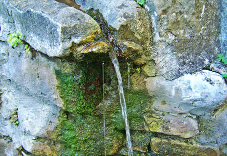 Small ancient fountain in Bobbio, Piacenza - Italyの写真素材