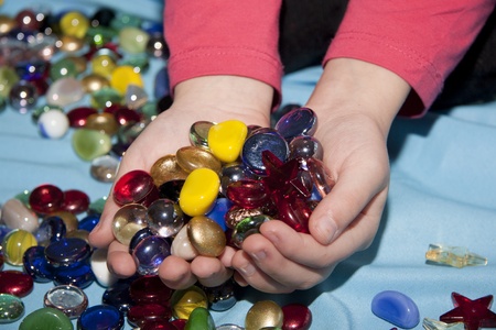 colored glass stones for child education and for design on the handsの写真素材