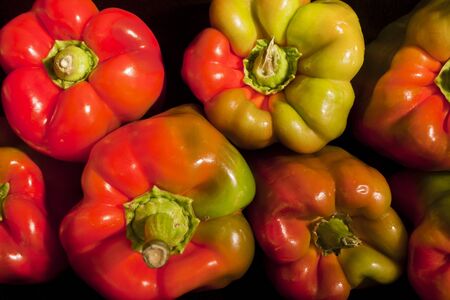 colored big sweet pepper on the black background