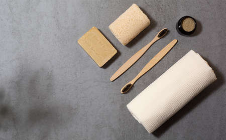 Zero waste tools for personal hygiene. Eco toothbrush, olive soap, cotton towel, tooth-powder and cotton swaps. Free space for text.の写真素材