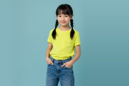 Casual Asian Girl Standing with Hands in Pocketsの素材