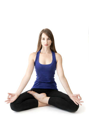 Young woman meditating in yoga postureの写真素材