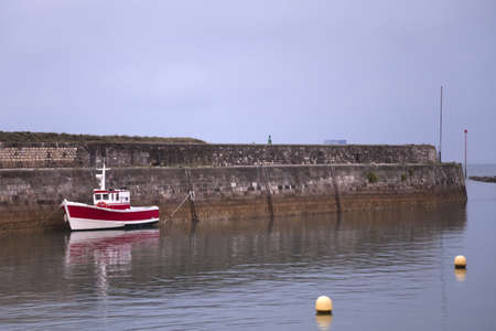 Fishing boat in a French port の写真素材