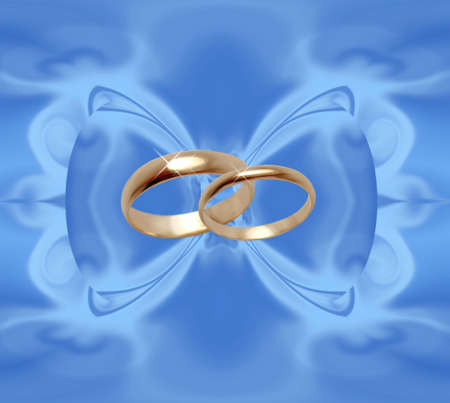Abstract blue background with wedding ringsの写真素材