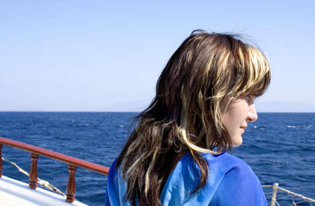 Young beautiful girl on a yachtの写真素材
