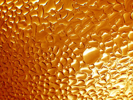Golden Drops on glass close-up