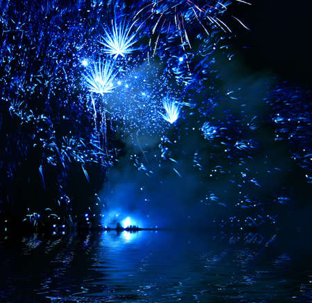 Celebratory firework. Firework reflection in waterの写真素材