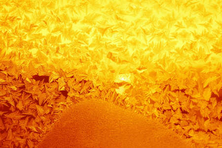 Golden frosty pattern on window 