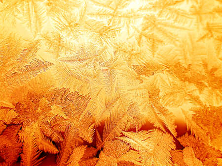 Golden frosty pattern on window の写真素材