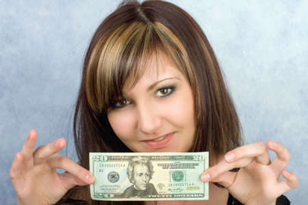 Pretty young woman with American dollarsの写真素材
