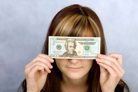 Pretty young woman with American dollars