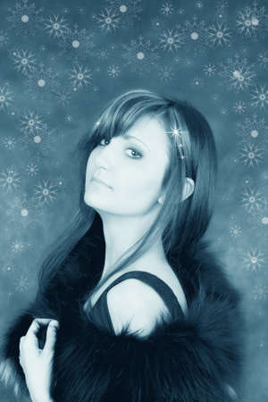Snowy charming girl with snowflakes ib blue colorの写真素材