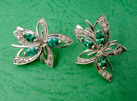 Jewelry with emerald on green backgroundの写真素材