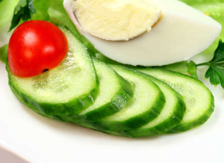 Vegetarian salad with cucumber, lettuce,  tomatoの写真素材