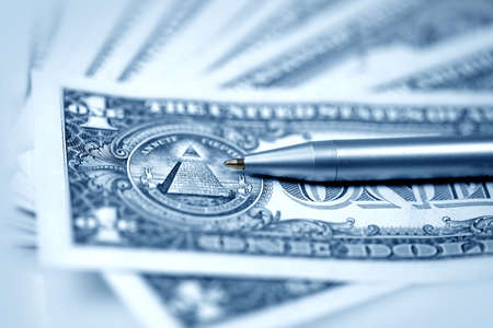 The American money dollars. Bundle of bank notes  and pen
の写真素材