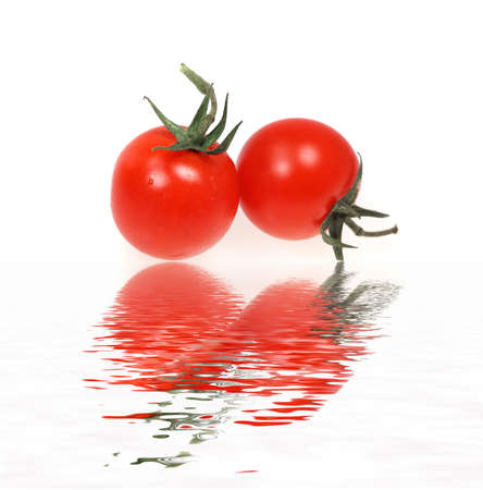 Vegetable tomato  cherry on a white backgroundの写真素材