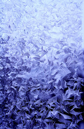 Frosty natural pattern at a winter window glass