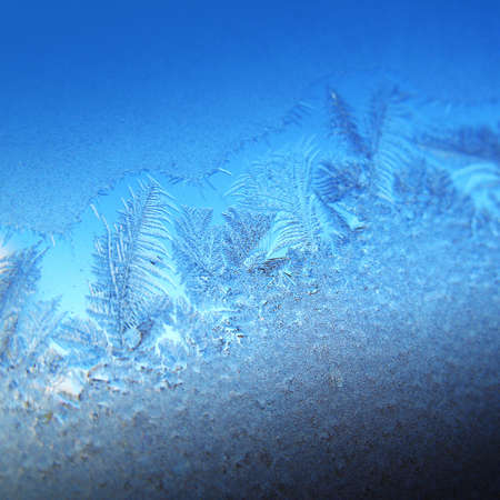 Frosty original  pattern at a winter window glass, natural texture
の写真素材