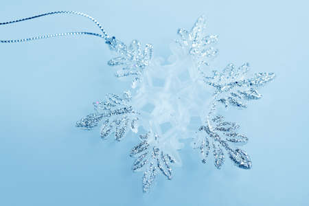 Christmas decorations -  toys silver snowflakes on blue backgroundの写真素材