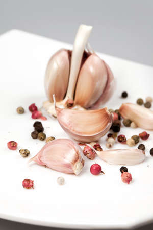 Seasoning -  garlic and pepper on a white backgroundの写真素材