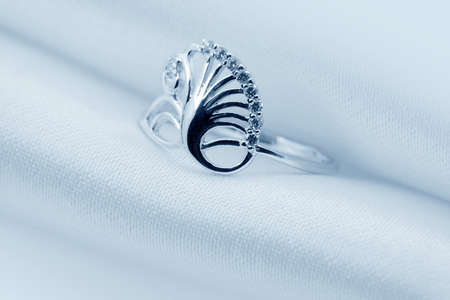  Elegant jewelry ring with jewel stone on a background of silkの写真素材