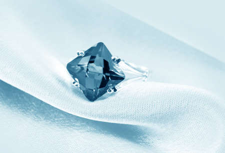  Elegant jewelry ring with jewel stone on a background of silkの写真素材