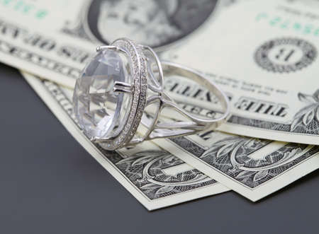  American dollars. Bundle of bank notes and brilliant ringの写真素材