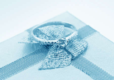  Elegant jewelry ring with jewel stone on a background of silky bow の写真素材