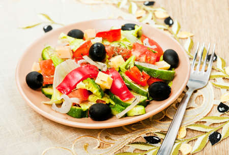 Food - plate with snack - Greek salad of vegetables on a tableの写真素材