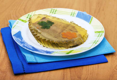 Meat in jelly from beef on a plate
