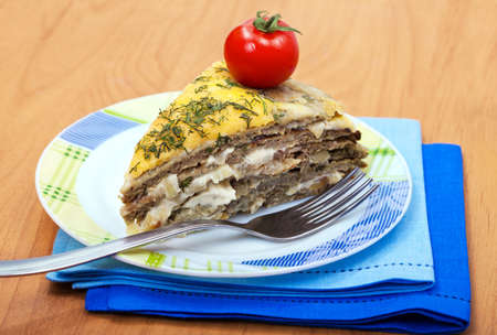 Tart of meat -  liver with cheese and tomatoの写真素材