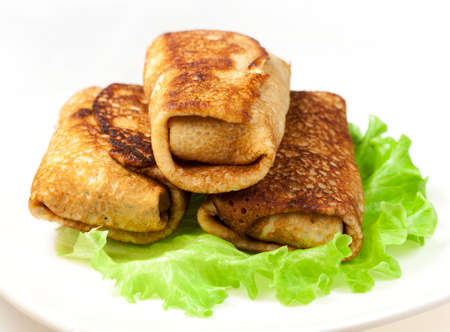Russian traditional pancakes with meat  on a plate