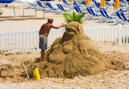 CANNES, FRANCE - June 13:The man has made a sculpture of sand on a beach,  in Cannes, French Riviera, France, Europe; June 13, 2010のeditorial素材